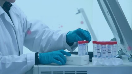 Poster - Animation of spots over caucasian male scientist with test tubes
