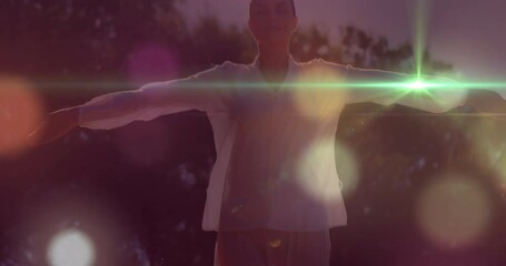 Poster - Animation of light spots over caucasian woman with arms wide