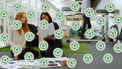 Poster - Animation of recycling icons over happy diverse female coworkers in office
