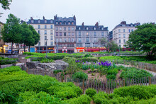 Garden Next To  Church Of St. Joan Of Arc  And Lights Of Cafe In Downtown Of  Capital Of Normandy