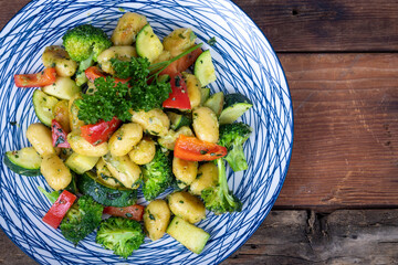 Wall Mural - Herb and cheese gnocci pasta with veggies