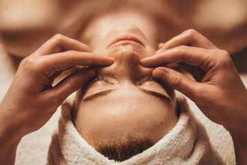 Wall Mural - female patient receiving face massage of detox therapy, at the spa salon. attractive beautiful girl.