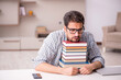 © Elnur - Young male student preparing for exams at home