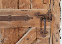 Wooden Antique And Rustic Barn Lock  Door Under Old Construction.