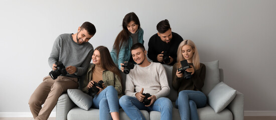 Group of young photographers during master class in studio