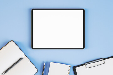 Poster - Top view and close up of empty white tablet on blue desktop with supplies. Work place and stationery objects concept. Mock up, 3D Rendering.