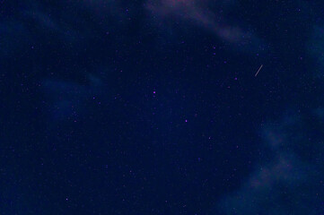 Wall Mural - Stars on background of the night starry sky. Milky Way, galaxies and universes on a dark blue background