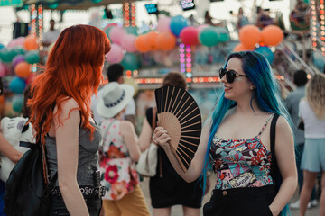 Two alternative friends at the fair during their holidays