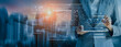 © SOMKID - Future building construction engineering and technology project concept. double exposure graphic with engineer using digital tablet and smart industry and IOT software to control operation.