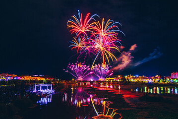 Fireworks over a park in the night sky, happy new year, year 2022-2023