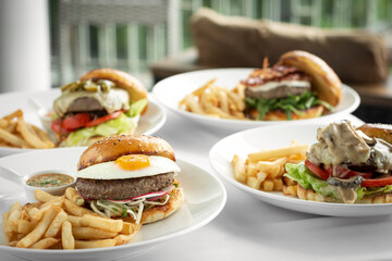 Wall Mural - selection of many different burgers on restaurant table