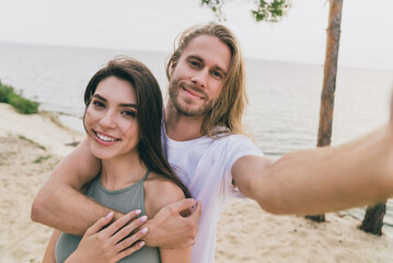 Poster - Photo of sweet attractive husband wife walking hugging tacking selfie enjoying summer time outdoors ocean seaside