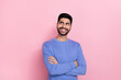 Photo of funny dreamy arabian man wear long sleeve shirt arms folded looking empty space isolated pink color background