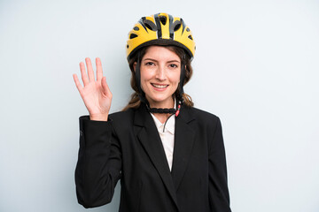 pretty young adult businesswoman with a bike helmet