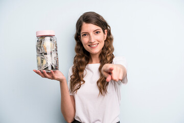 Wall Mural - pretty young adult woman with dollar banknotes bottle. savings concept