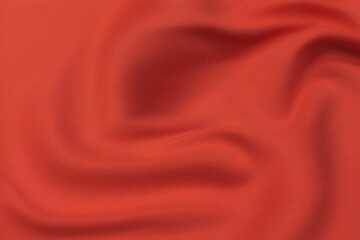 Wall Mural - Close-up texture of natural red or pink fabric or cloth in same color. Fabric texture of natural cotton, silk or wool, or linen textile material. Red and orange canvas background.