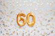 Number 60 sixty golden celebration birthday candle on Festive Background. sixty years birthday. concept of celebrating birthday, anniversary, important date, holiday
