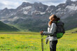 © Antonioguillem - Hiker breathing fresh air in a high mountain