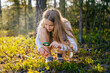 © Iryna - Teenage girl holding magnifying glass explores nature and the environment. Future profession ecologist or biologist.