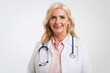 © gzorgz - Senior female doctor studio portrait