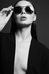 Beautiful sexy woman in sunglasses. beauty girl black and white portrait