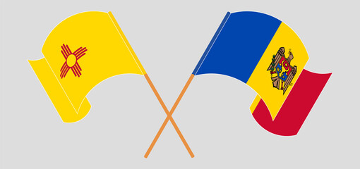 Crossed and waving flags of the State of New Mexico and Moldova