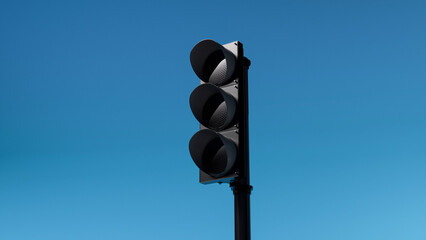 not working or turned off triple black traffic light isolated on blue sky background. Mock-up or source. 3d render