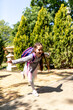© яна винникова - Back to school. Cute child girl with backpack running and going to school with fun