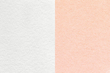 Texture of craft white and pink paper background, half two colors, macro. Structure of vintage dense pearl rose cardboard