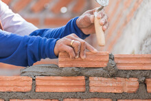 Bricklayer Working In Construction Site