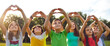 © Studio Romantic - Group of happy good kind little children standing in row in green sunny summer park, looking at peaceful skies up above, raising hands, and doing heart gestures. Banner, header. Love and peace concept