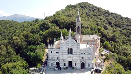 Italy, Rapallo, Liguria, Drone aerial view of the Catholic Church sanctuary of Montallegro stands on the top of the  mountain overlooking the sea of the bay of Portofino near Genova and Cinque Terre