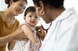 © offsuperphoto - mother and baby visit to the doctor using stethoscope checking heart beat