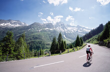 Active Male Tourist Enjoys A Scenic Bicycle Trip Along The Great Alpine Route.