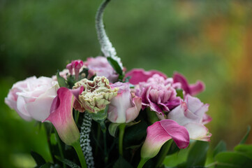 Wall Mural - Hand tied exquisite bouquet features antiqua carnations, elegant Calla Lilies, Roses and fragrant Eucalyptus.