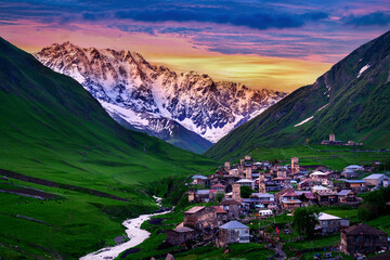 Wall Mural - Ushguli village near highest georgian mountain Shkhara at sunset in Svaneti, Georgia.