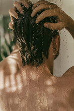 Young Man Having A Shower Outdoors.