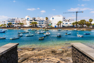 Wall Mural - Beautiful downtown of Arrecife with many boats floating on blue water, Lanzarote, Canary Islands, Spain