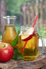 Wall Mural - Glass of apple juice and red apple