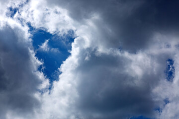 Wall Mural - Blue sky with sunlight and beautiful gray clouds.