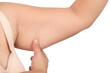 Fat woman using her finger to catch excess fat under her arms, which has a flabby appearancd, On white isolated background, to health woman and excess fat concept.