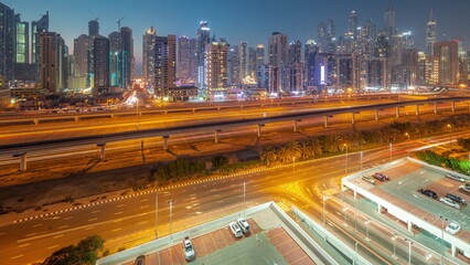 Wall Mural - Dubai marina tallest block of skyscrapers day to night timelapse.