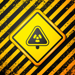 Sticker - Black Triangle sign with radiation symbol icon isolated on yellow background. Warning sign. Vector