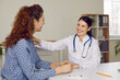 © Studio Romantic - Friendly female doctor touches patient's shoulder telling her good news during conversation in medical office. Concept of doctor-patient relationship, good news and health.
