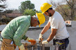 © richard - bricklayers with yellow helmet and protective glasses building an iron beam for reinforced concrete - PHOTO SESSION: WORK IN CONSTRUCTION