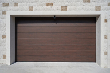 Wall Mural - Modern and wide brown garage door. Automatic garage door