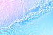 Serum or water texture close up. Blue and pink gradient liquid gel background. Transparent beauty skincare sample. Water clear transparent background. Banner with copy space
