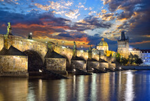 Scenic View Of Of The Vltava River, Charles Bridge And Old Town Bridge Tower In Prague In The Late Evening Against A Dramatic Sky. Karluv Most In The Capital Of The Czech Republic, Prague
