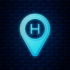 Glowing neon Helicopter landing pad icon isolated on brick wall background. Helipad, area, platform, H letter. Vector