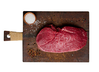 Wall Mural - Raw beef tenderloin lies on a cutting board and spices for cooking